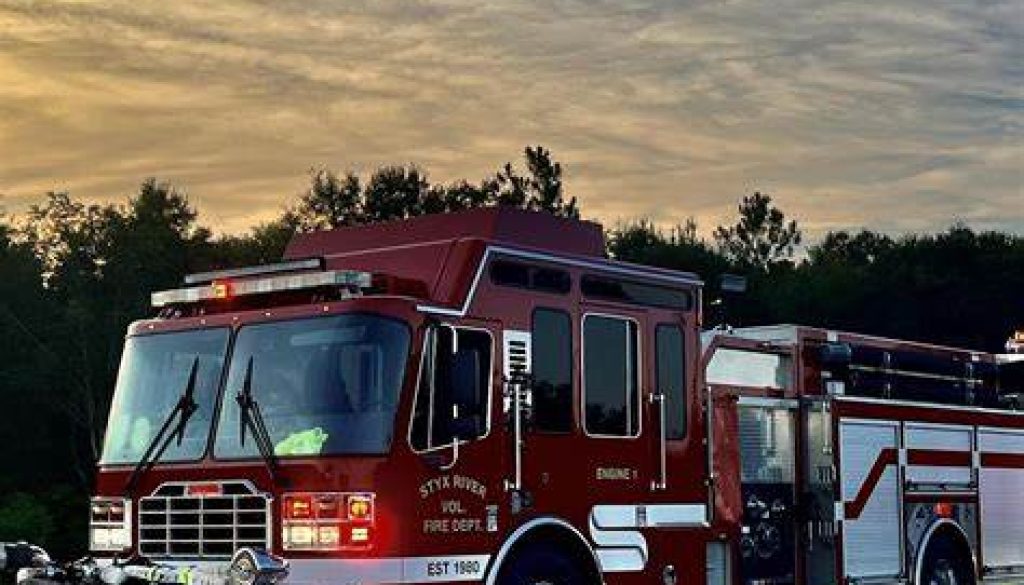 Two Persons Rescued as Truck Begins to Float Away